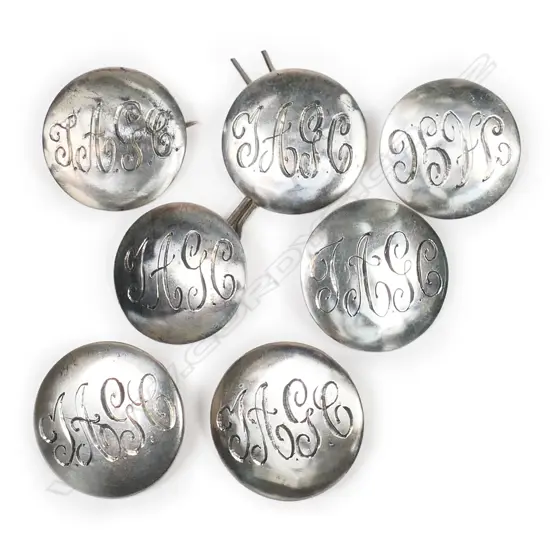 A set of six Kohn & Co silver golf buttons,
